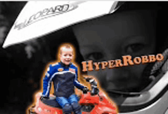 a young boy is sitting on a motorcycle with the word hyper robbo written on it