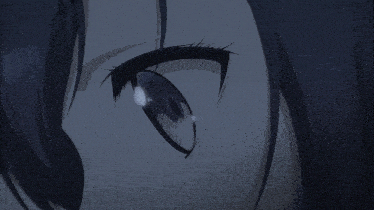 a close up of a person 's eye with a reflection of a person 's face