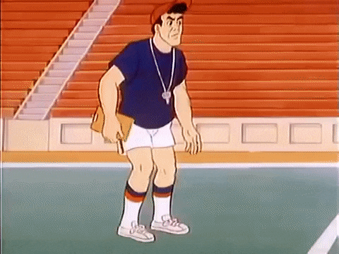 a cartoon man is standing on a basketball court in front of a bleacher holding a clipboard .