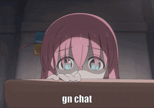 a girl with pink hair and blue eyes says gn chat in front of her face
