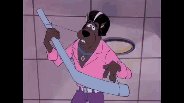 scooby doo is wearing a pink shirt and holding a blue stick .