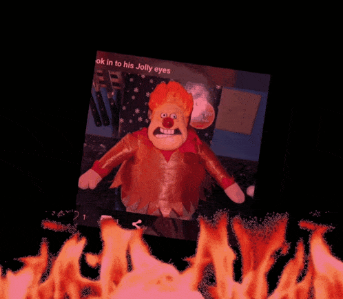 a cartoon character with red hair and a red nose is standing in front of flames