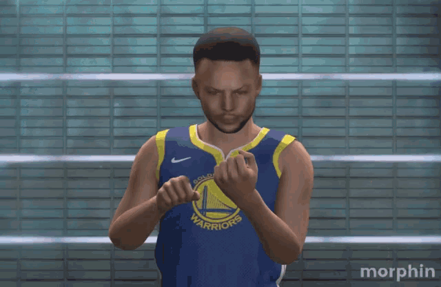 a man in a golden state warriors jersey clapping his hands