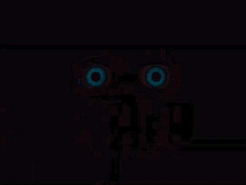 a close up of a person 's eyes in the dark