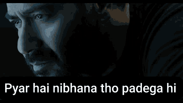 a close up of a man 's face with the words pyar hai nibhana tho padega hi above him