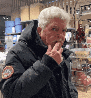 a man in a black jacket has a patch on his jacket that says ' arctic circle ' on it