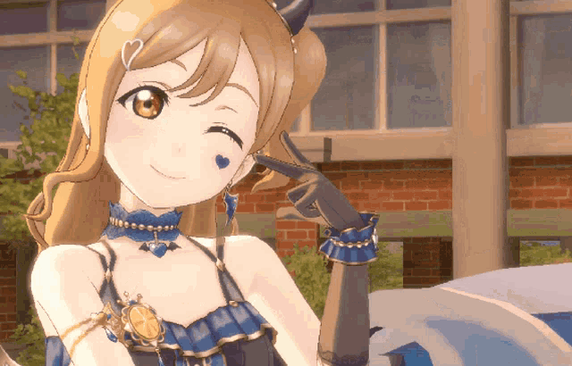 a close up of a girl with a blue heart on her face