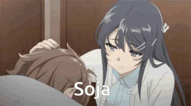 a girl is putting her hand on a boy 's head and the word soja is on the bottom right