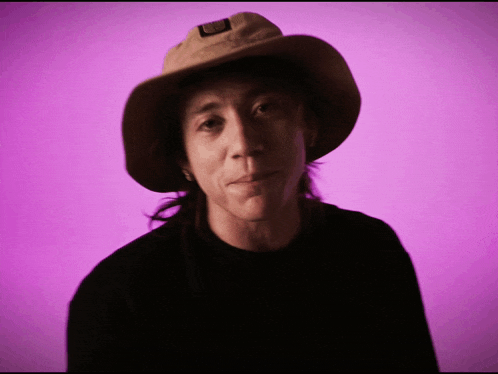 a man wearing a cowboy hat with a patch on it