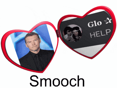 a picture of a man in a suit is on a heart shaped mirror