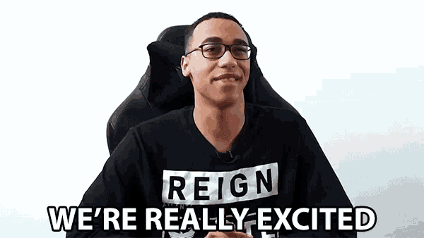 a man wearing a reign shirt is sitting in a chair and says we 're really excited