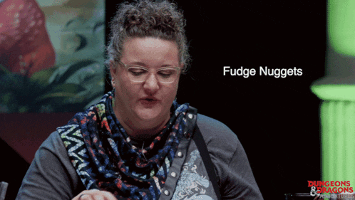 a woman wearing glasses and a scarf is eating fudge nuggets from dungeons and dragons