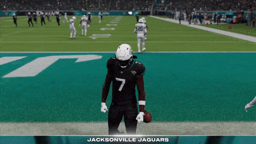 a football player for the jacksonville jaguars is holding a football