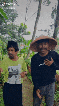 two men are standing next to each other and one has a shirt that says patagonia on it