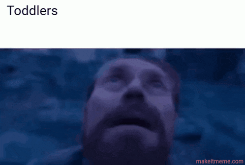 a man with a beard and blue eyes looks up at the sky with the words toddlers above him