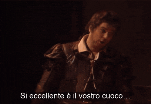 a blurry picture of a man with the words si eccellente e il vostro cuoco
