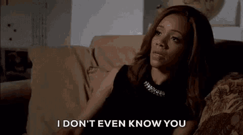 a woman is sitting on a couch and says `` i don 't even know you '' .
