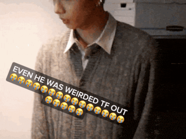 a man in a sweater has a sticker that says even he was weirded tf out on it