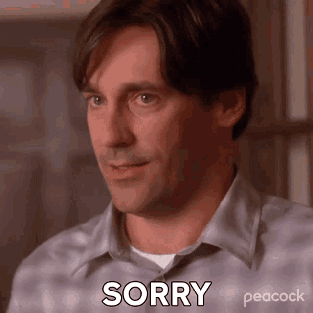 a man in a plaid shirt is saying sorry on peacock
