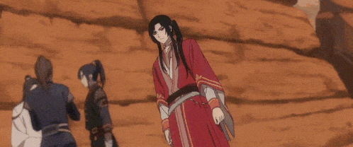 a close up of a anime character with red eyes