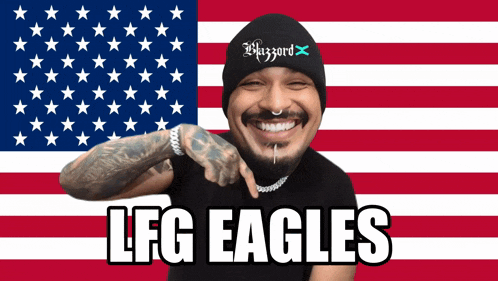 a man in front of an american flag with the words lfg eagles below him
