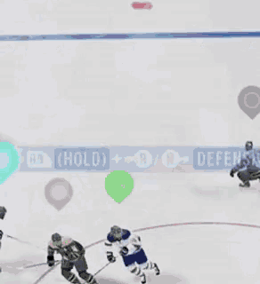 a hockey game is being played on the ice and the players are playing defense
