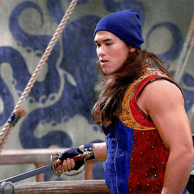 a man with long hair is holding a sword