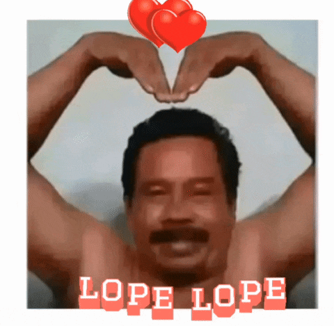 a shirtless man is making a heart shape with his hands and the words lope lope behind him