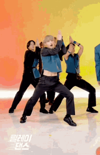 a group of men are dancing in front of a sign that says ' ioii ' on it