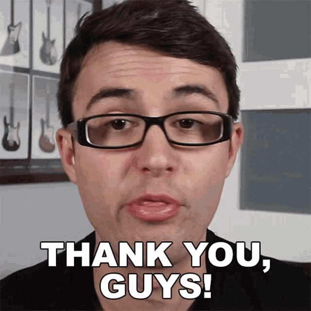 a man with glasses is saying thank you guys