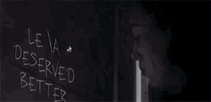 a woman is writing on a blackboard that says `` i deserved better '' .