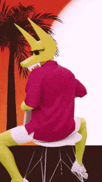 a man in a pink shirt and yellow mask is sitting on a chair