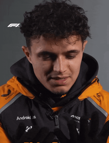 a close up of a man wearing a jacket with the word android on it
