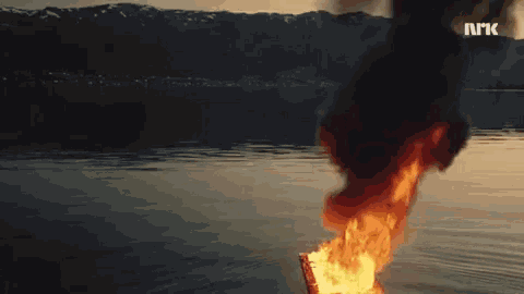 a fire is coming out of the water and the letters nrk are visible in the background