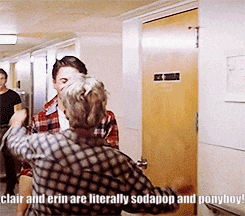 a couple of people standing in a hallway with the caption " clair and erin are literally sodapop and ponyboy ! "