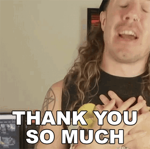 a man with long hair is holding a banana and saying " thank you so much "
