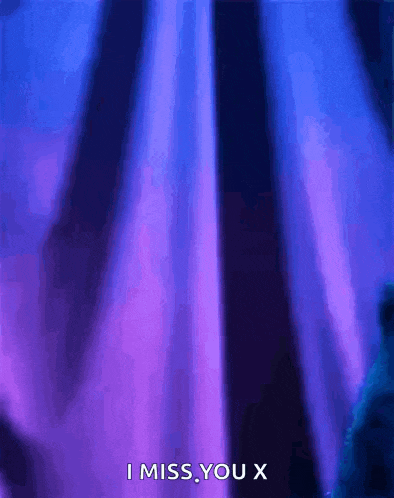 a purple curtain with the words `` i miss you x '' written on it .