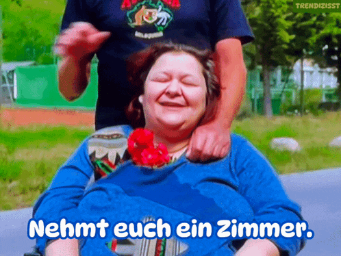 a woman in a wheelchair with the words nehmt euch ein zimmer written above her
