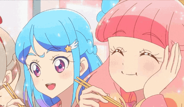 a girl with blue hair and a pink haired girl are eating with chopsticks