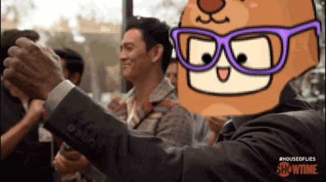 a man in a suit taking a selfie with a cartoon character behind him that says showtime on the bottom