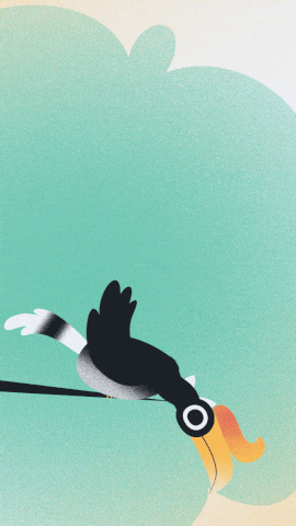 a black bird with a yellow beak is flying in the air