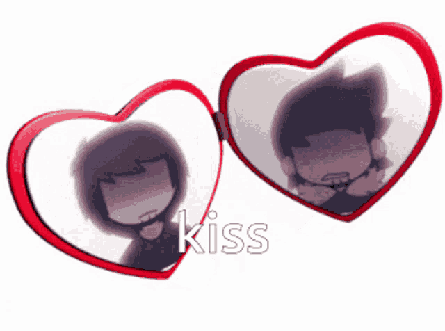 a couple of heart shaped mirrors with the word kiss on it