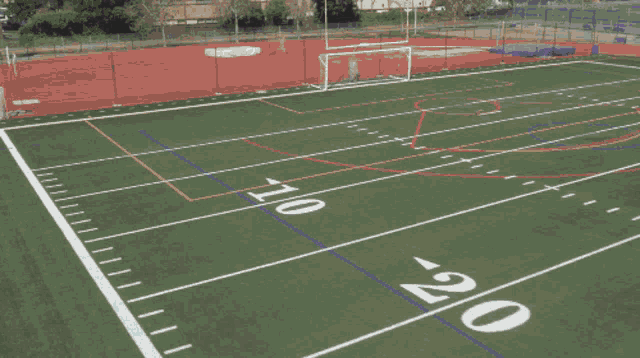 a blurred image of a football field with the number 7 on the sidelines