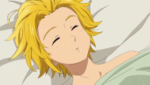 a boy with yellow hair is sleeping in a bed with his eyes closed