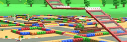 a blurred image of a lego track with trees in the background .