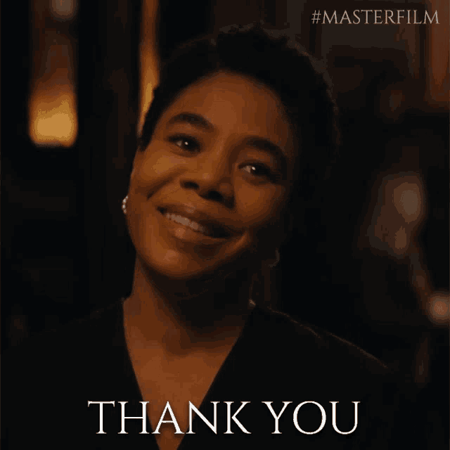 a woman is smiling with the words thank you written below her