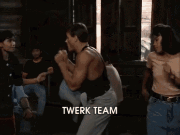a group of people are dancing and the word twerk team is visible in the corner