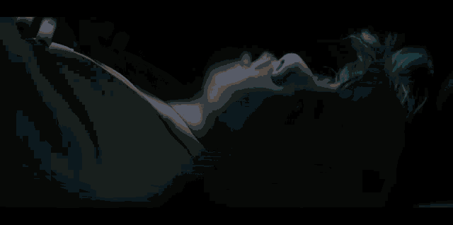 a pixel art of a red and blue object with the letters nz on it