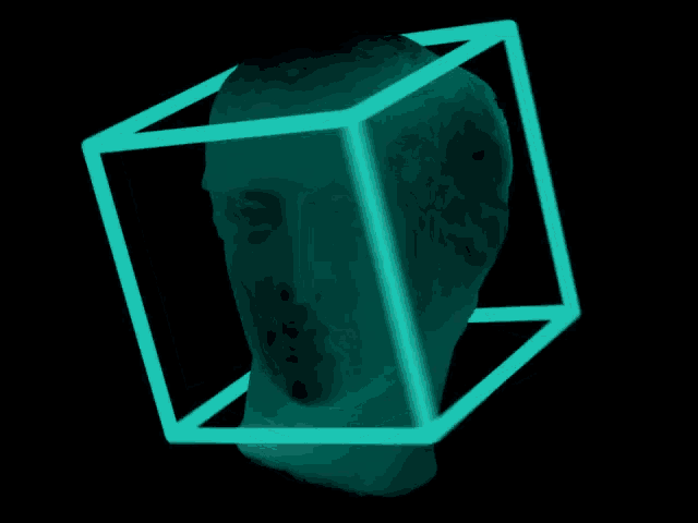 a statue of a head is surrounded by a blue cube