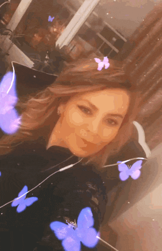 a woman with purple butterflies around her head